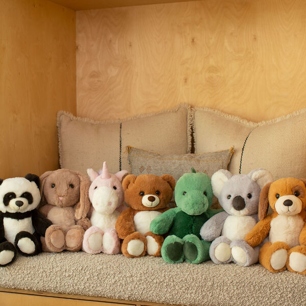 15" Cuddle Chunk Bunny - Panda, Bear, Bunny, Unicorn, Dinosaur, Koala, and Puppy in a living room scene