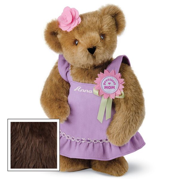 15" Prettiest Mom Ever Bear - Front view of standing jointed bear dressed in a lilac sundress with felt flower pin that says "Prettiest Mom" in pink and pink flower on ear. Dress is personalized with "Anna" in cream on front - Vanilla white fur