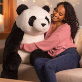 3 1/2' Gentle Giant Panda - Front view of seated black and white Panda with model in a Valentine's Day scene image number 4